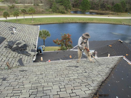 Close up of a fresh roof patch on asphalt shingles after a summer storm