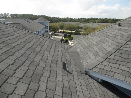 Roofing contractor performing roof inspection on a jacksonville fl home